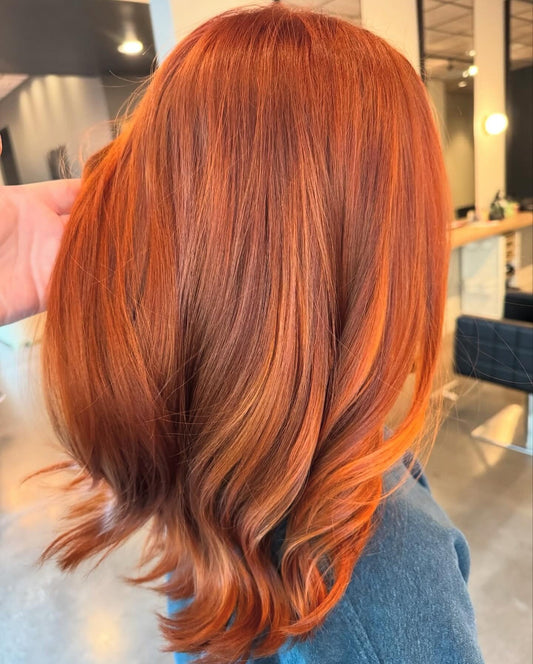 Copper balayage with soft dimension through the mid-lengths and ends, styled at Whistle & Sway Salon Company in Fort Worth